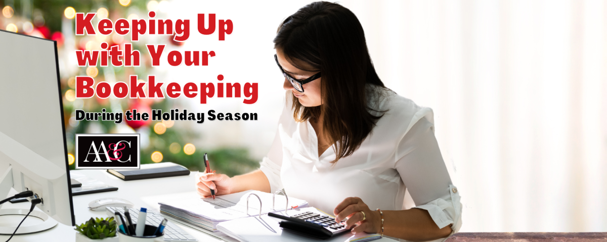 Woman sitting at desk keeping up with bookkeeping during the holiday season
